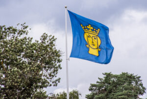 Flagga med Stockholms stads logga. Foto: Mostphotos